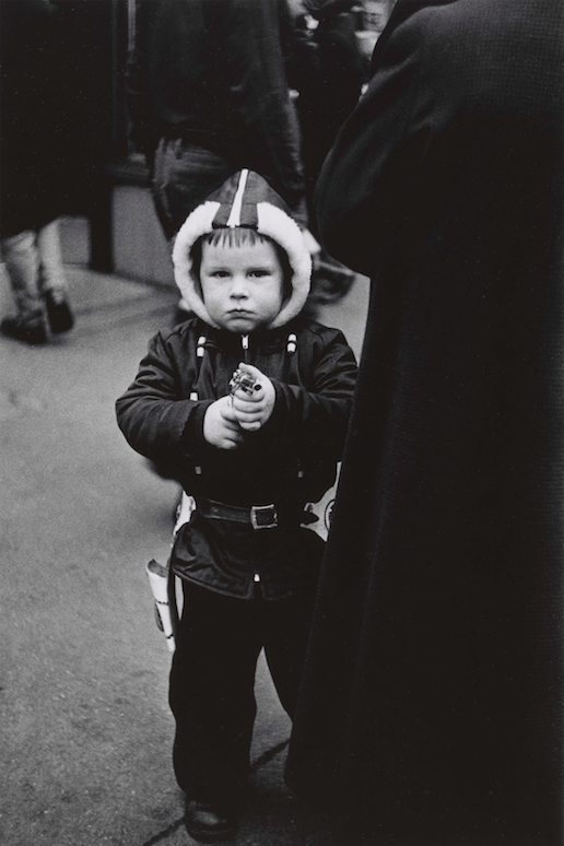 7. Kid in a hooded jacket aiming a gun, N.Y.C. 1957